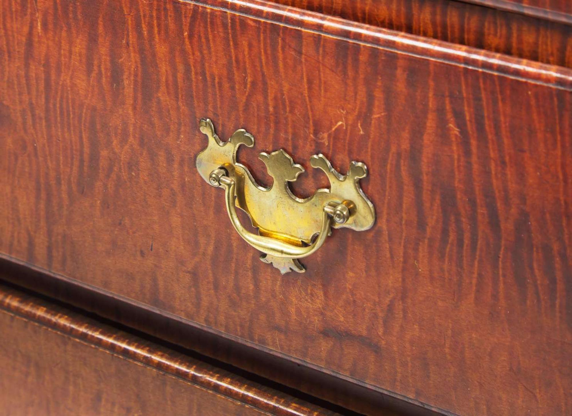 A Chippendale figured maple chest of drawers, New England, late 18th century