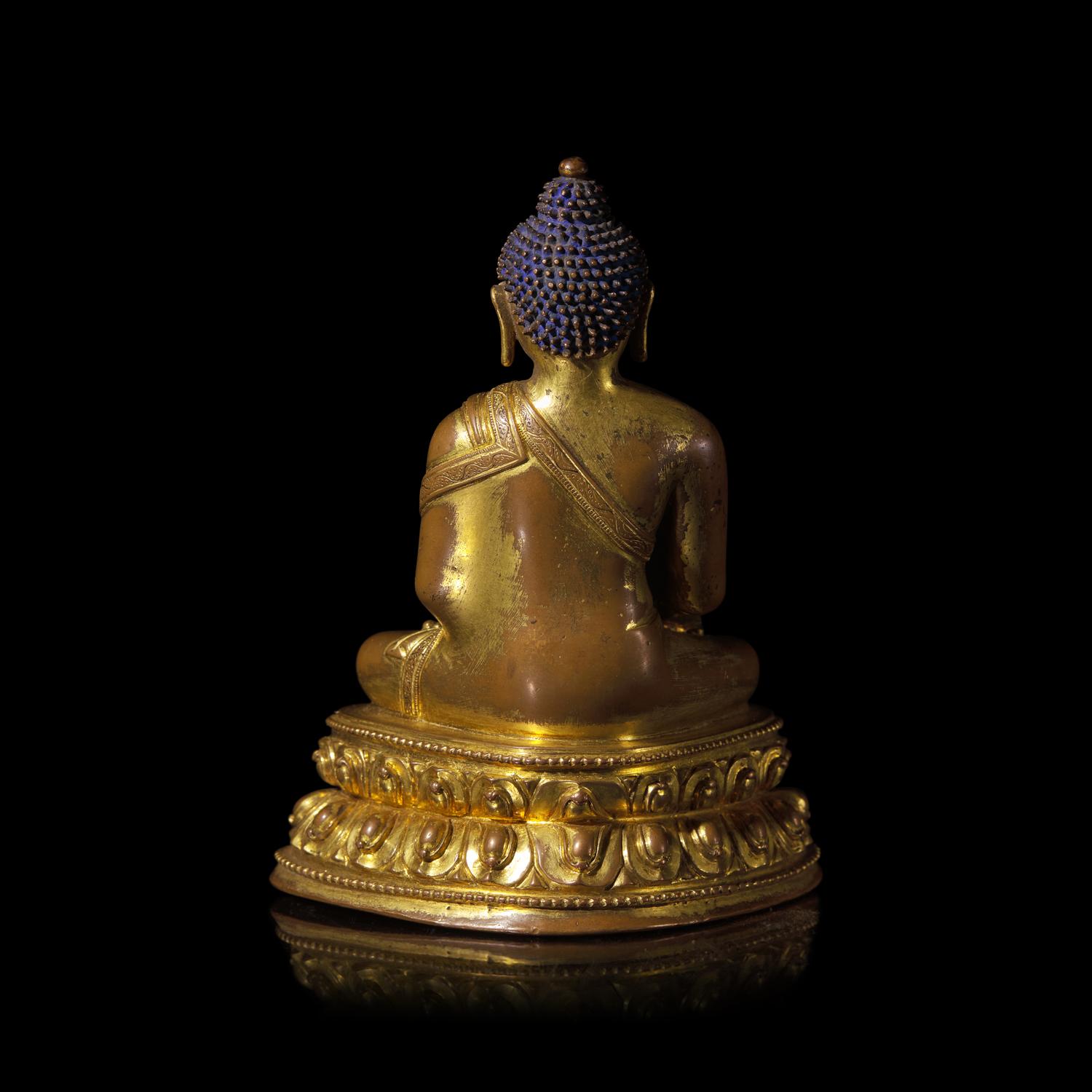 A Tibetan Gilt Copper Alloy Figure of Seated Akshobya, 15th Century 十五世紀 藏傳銅合金阿閦佛