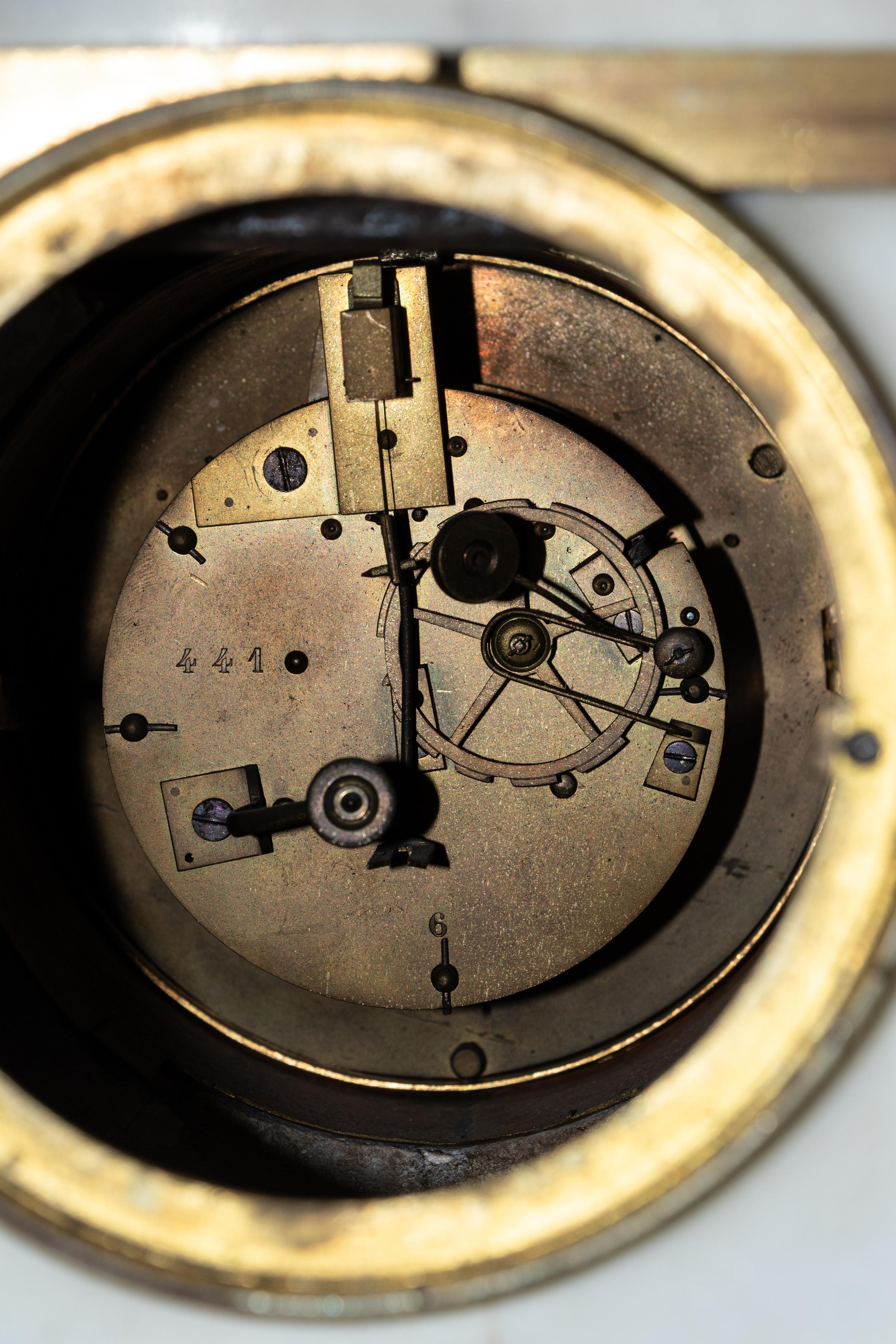 A French Gilt and Patinated Bronze Mounted Marble Mantel Clock