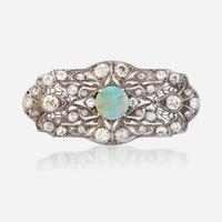 An opal, diamond, and platinum pendant/brooch
