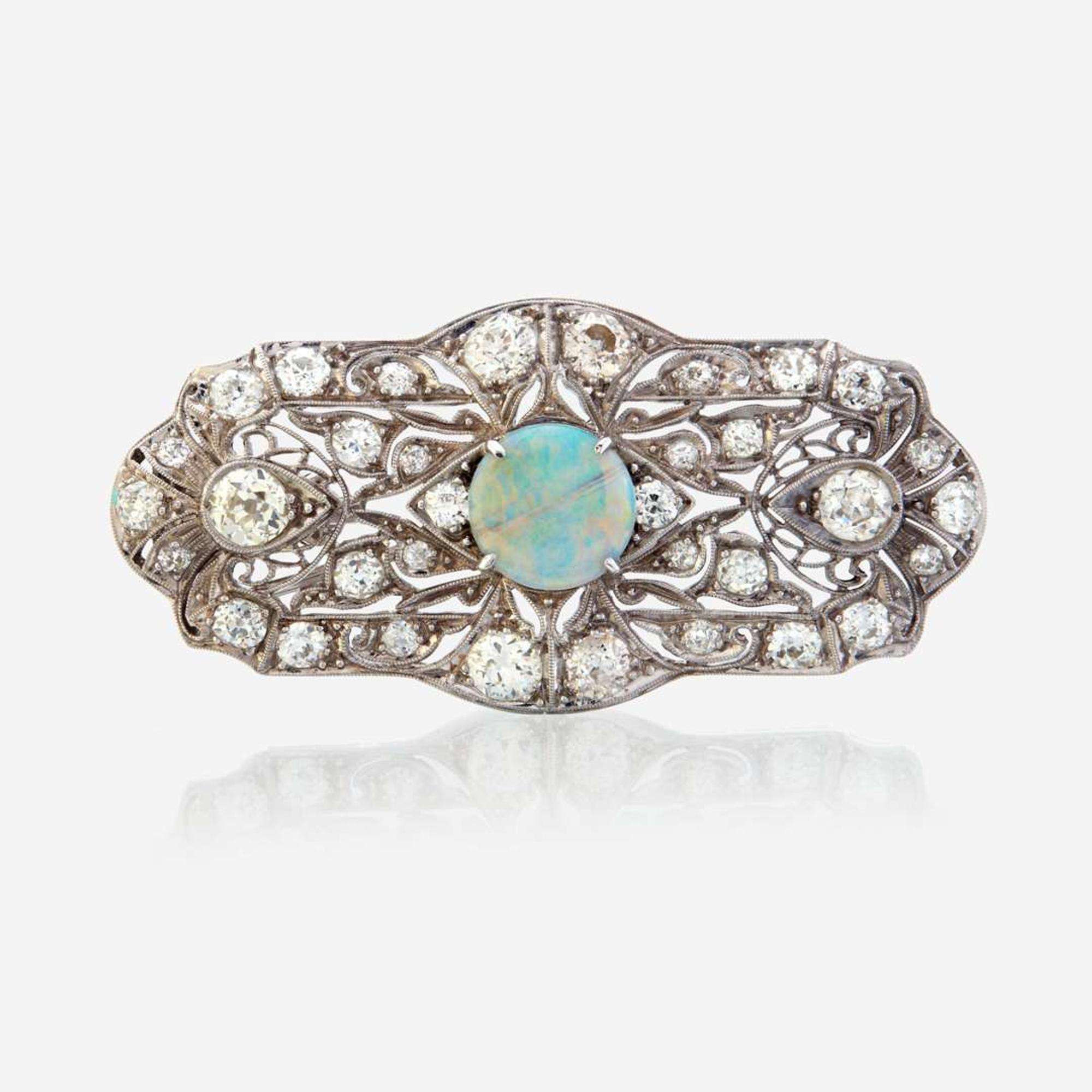 An opal, diamond, and platinum pendant/brooch