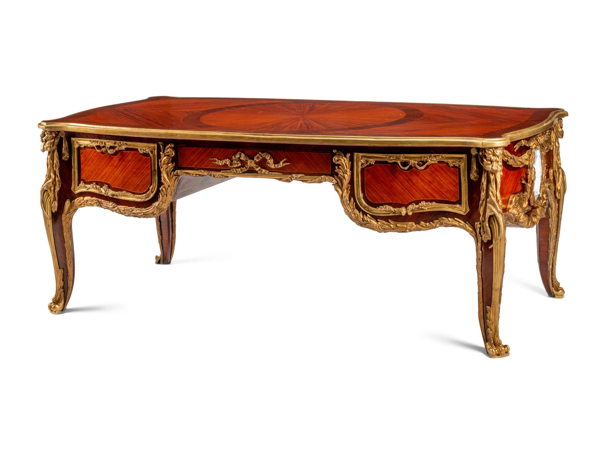 A Louis XV Style Gilt Bronze Mounted Kingwood and Plaque-Inset Bureau Plat