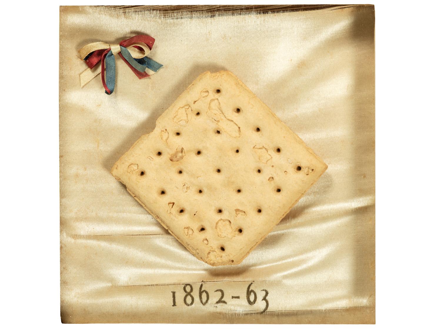 [CIVIL WAR]. Framed hardtack with tri-color ribbon, dated 1862-1863.