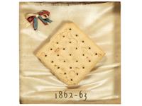 [CIVIL WAR]. Framed hardtack with tri-color ribbon, dated 1862-1863.