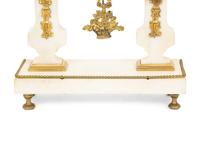 A French Gilt Bronze and Marble Mantel Clock with an Associated Pair of Urns