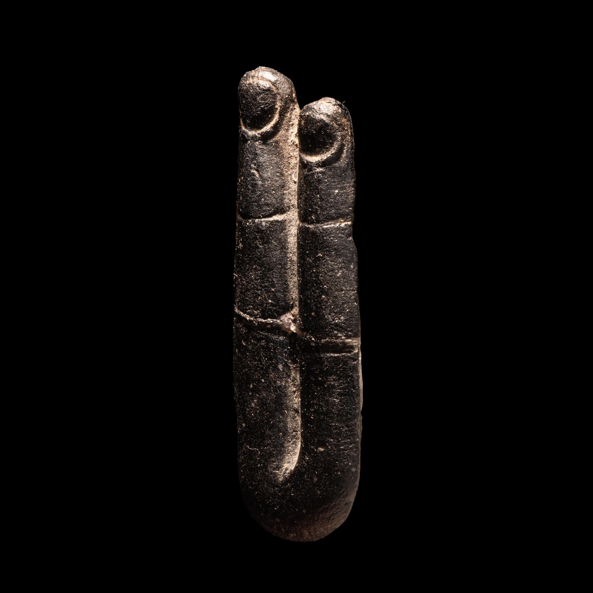 An Egyptian Stone Two-Finger Amulet
