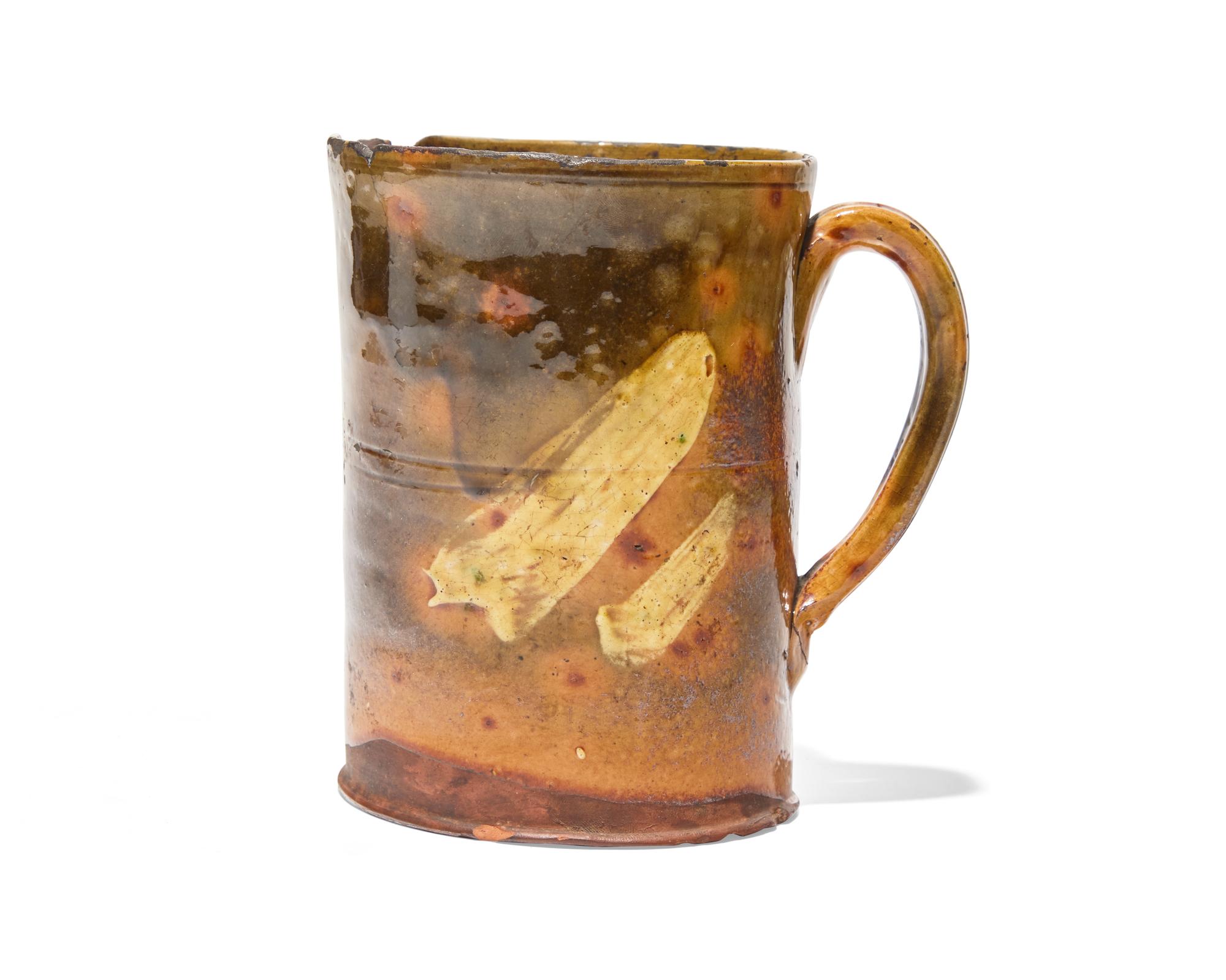 A Glazed and Slip-Decorated Redware Mug