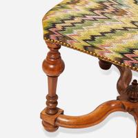 A small Louis XIV carved beech stool early 18th century