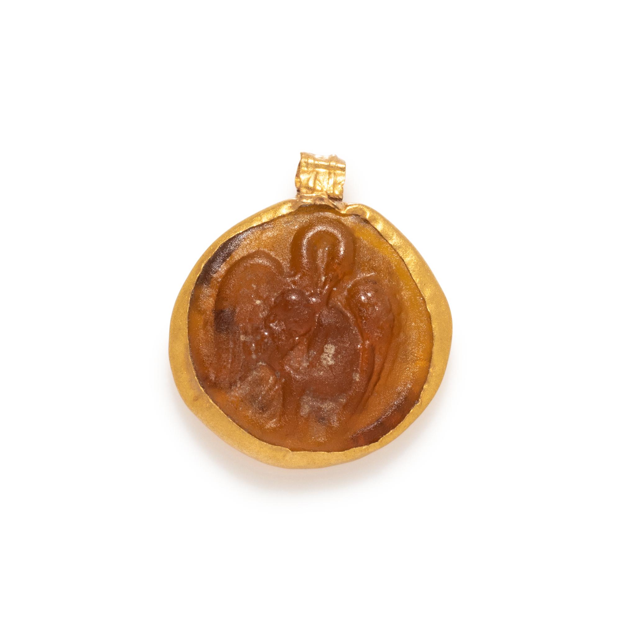 A Roman Gold and Glass Pendant with the Princess Leda and the Swan