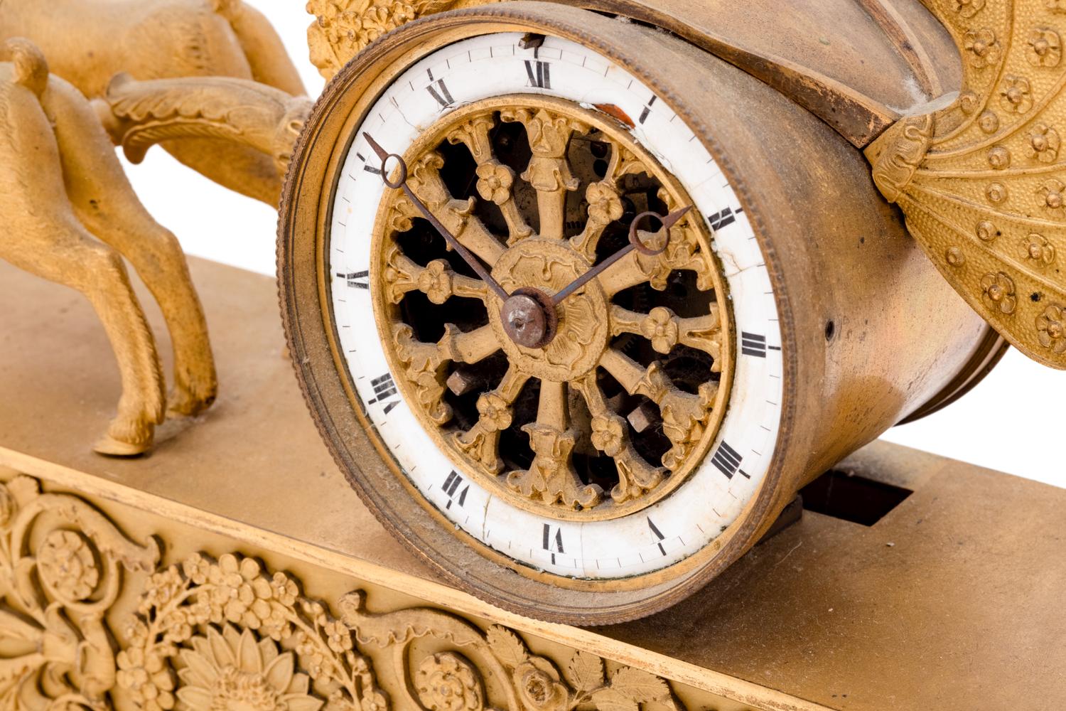 An Empire Style Gilt Bronze Figural Clock