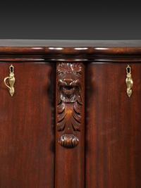 A Salter Double Bow-Front Lion Mask Carved Mahogany Record Cabinet