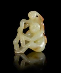 A Yellow and Russet Jade Monkey Group Height 2 inches. — 18TH/19TH CENTURY
