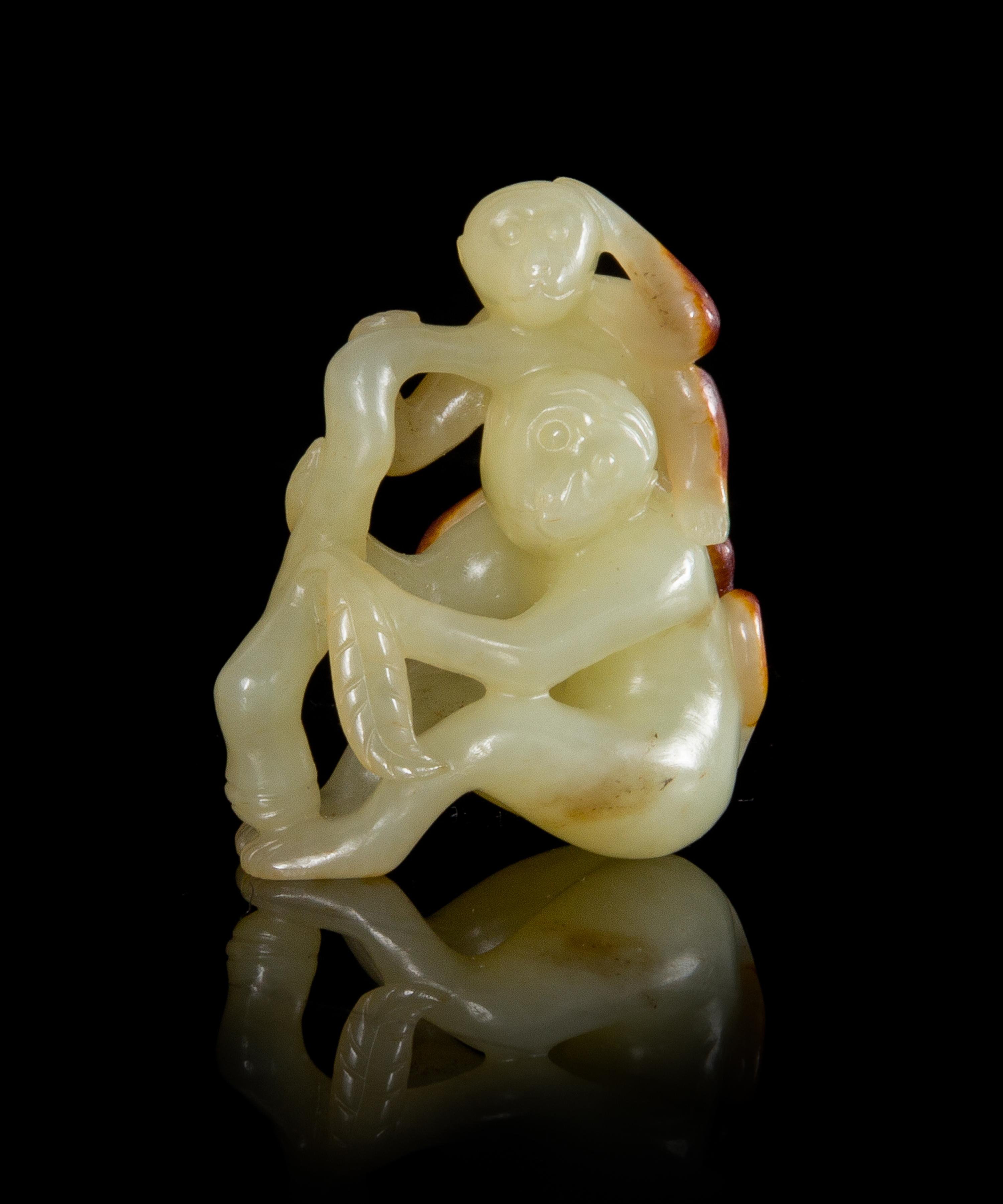 A Yellow and Russet Jade Monkey Group Height 2 inches. — 18TH/19TH CENTURY