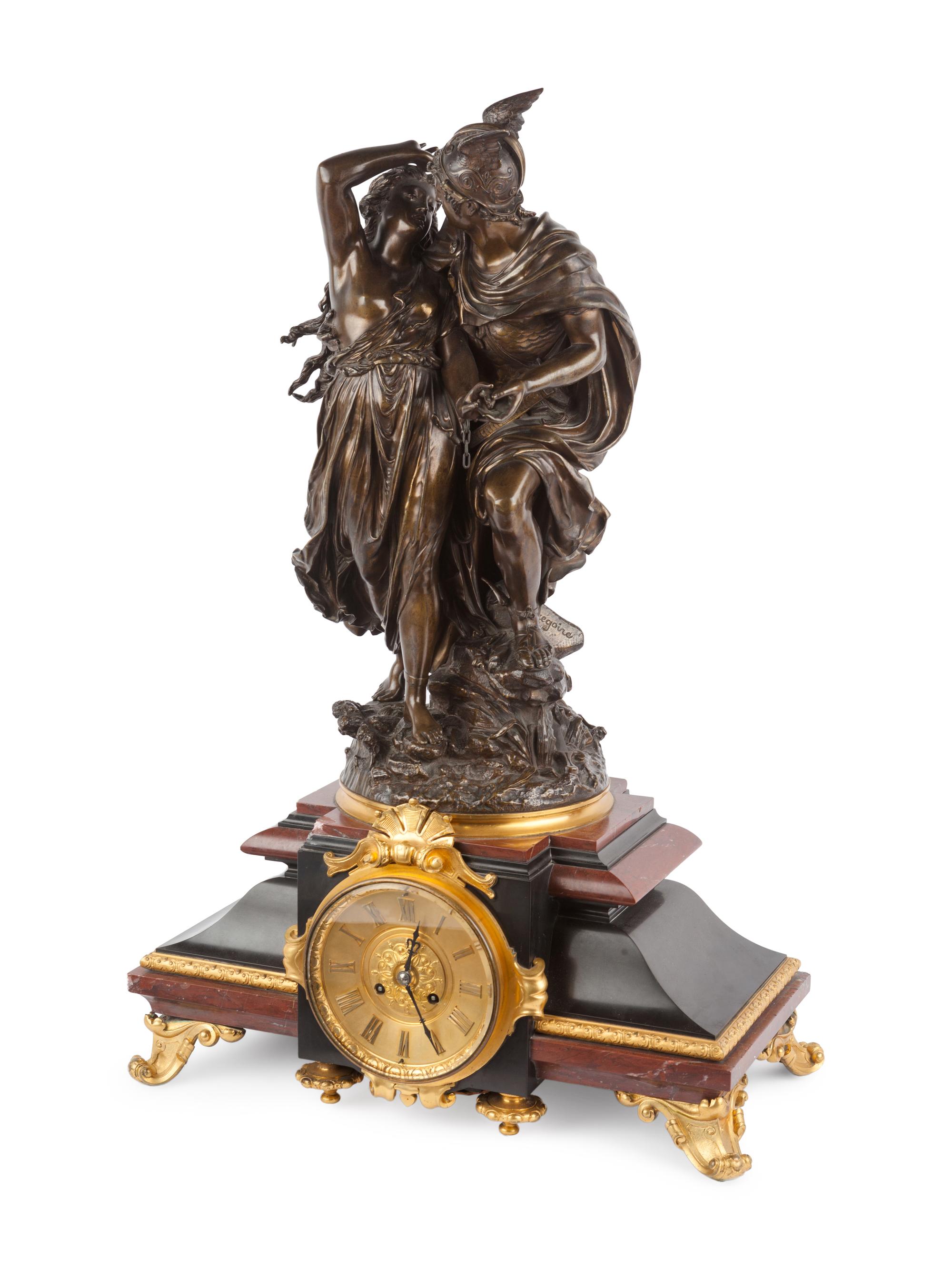 A French Gilt and Patinated Bronze and Marble Mantel Clock