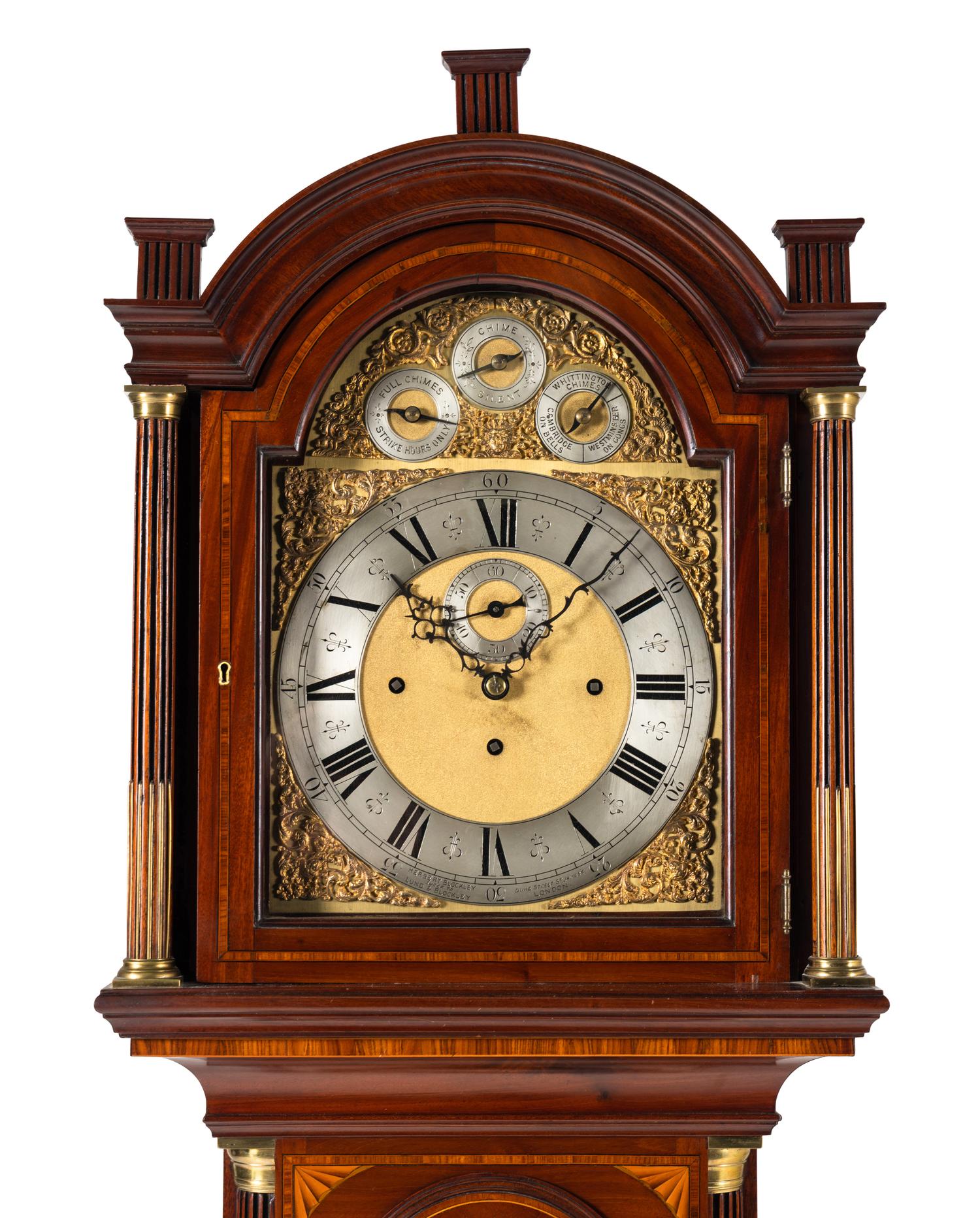 An Edwardian Mahogany and Marquetry Tall Case Clock