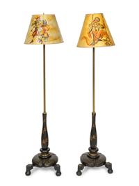 A Pair of Ebonized Parcel Gilt Floor Lamps with Papier Mache Shades