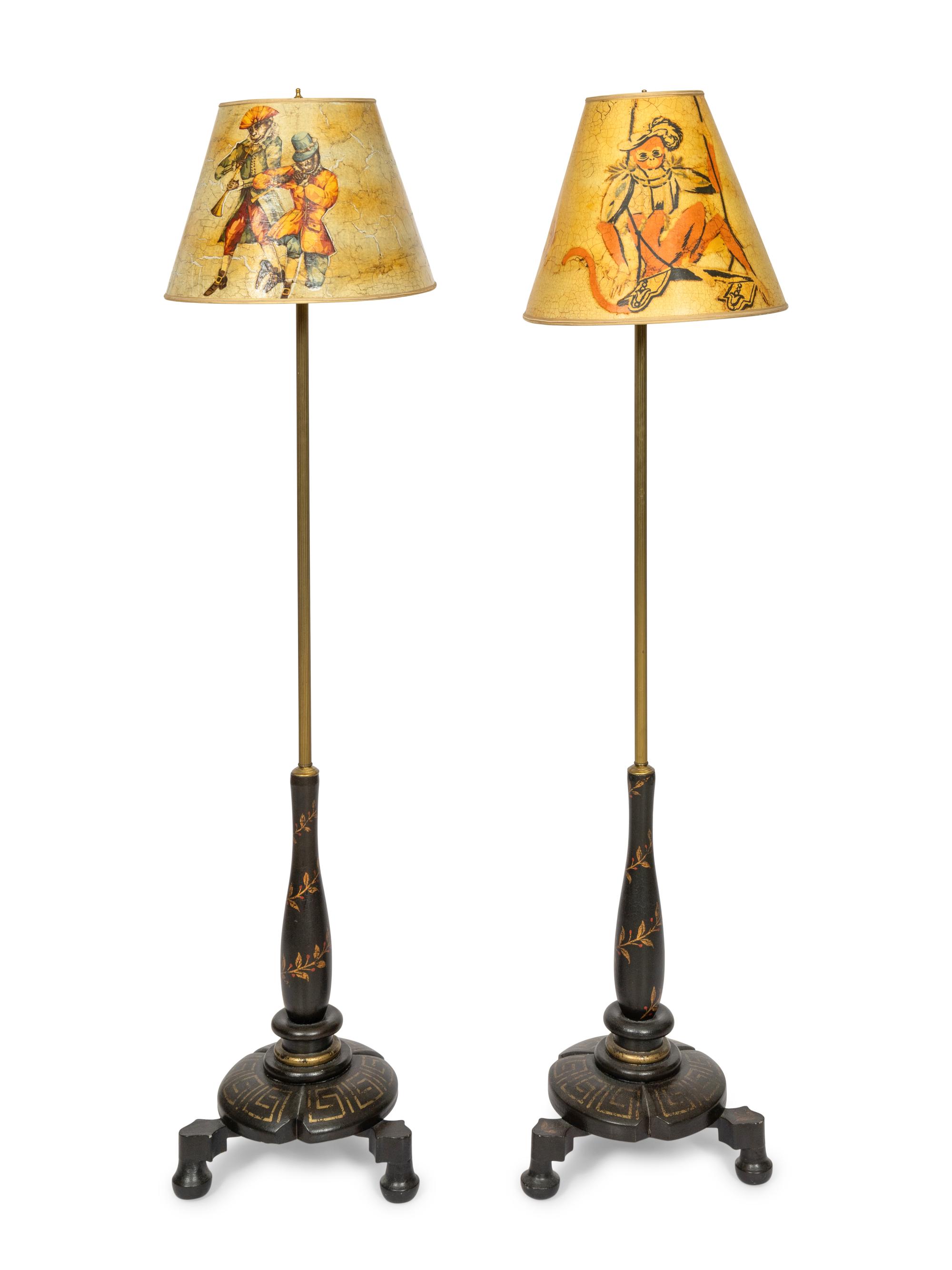 A Pair of Ebonized Parcel Gilt Floor Lamps with Papier Mache Shades