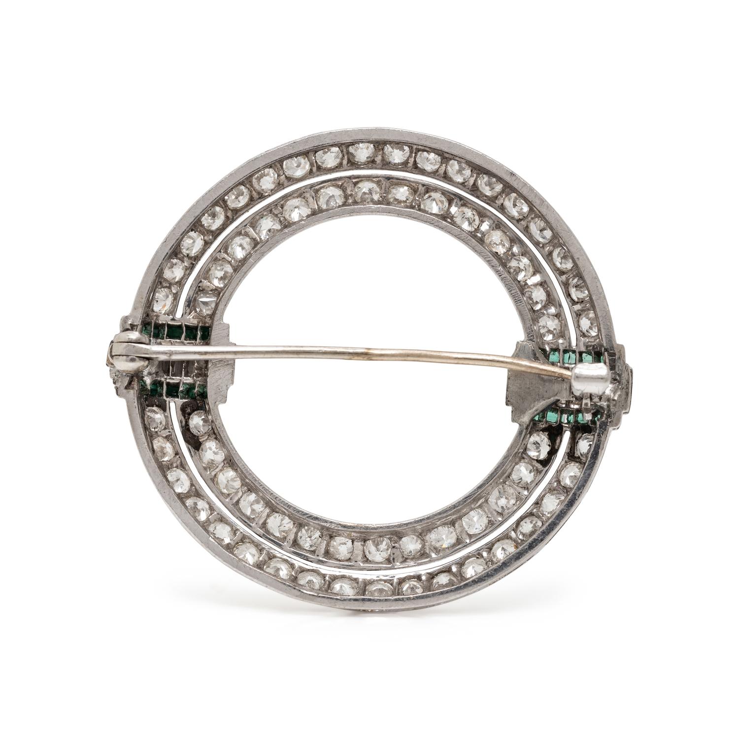 ART DECO, DIAMOND AND SYNTHETIC EMERALD CIRCLE BROOCH