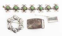 A Group of Four Silver Accessories, , including a buckle, two pins, and a Mexican silver and hardstone bracelet.