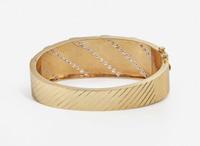 A 14K Yellow Gold and Diamond Bangle Bracelet