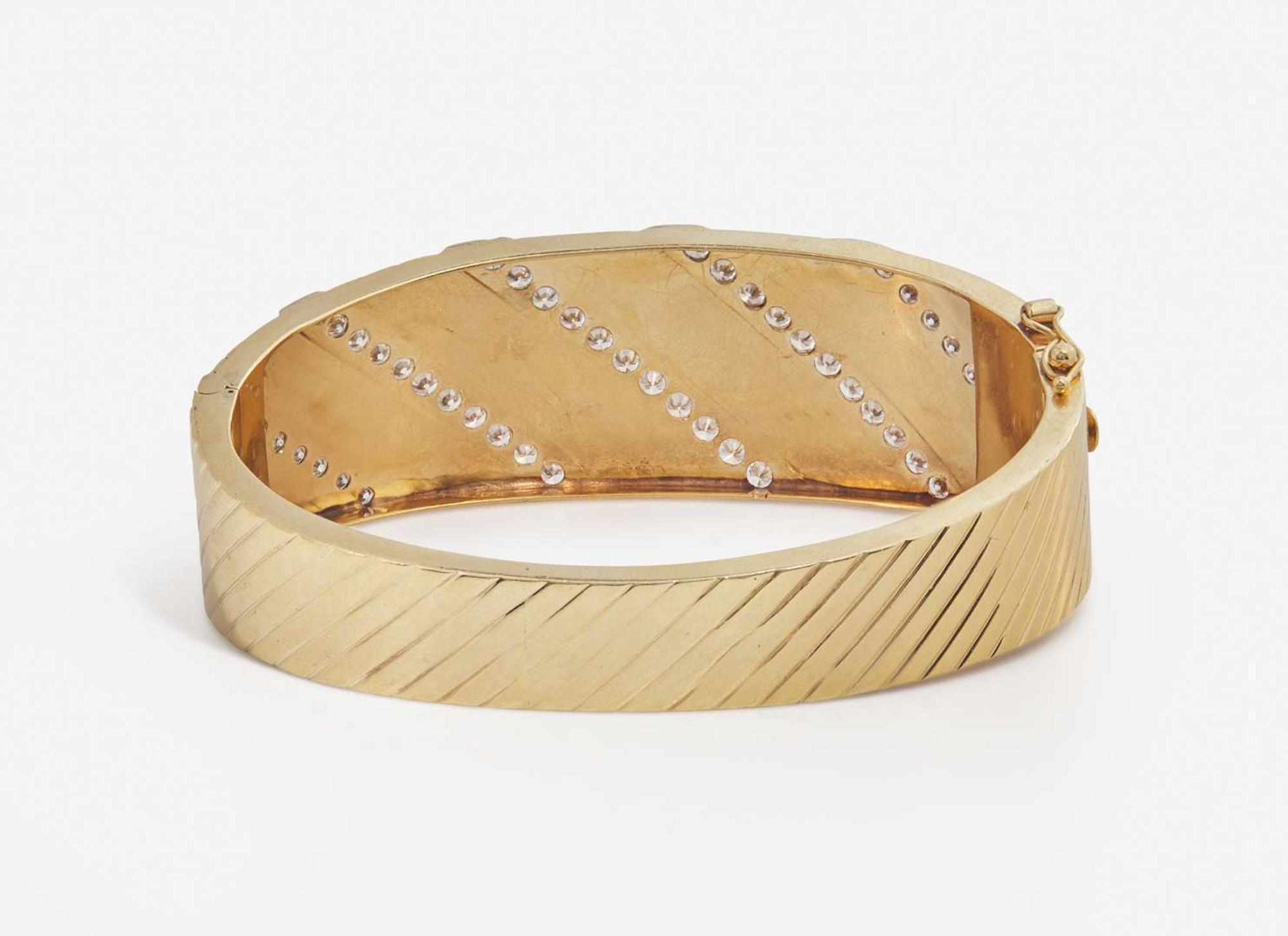 A 14K Yellow Gold and Diamond Bangle Bracelet