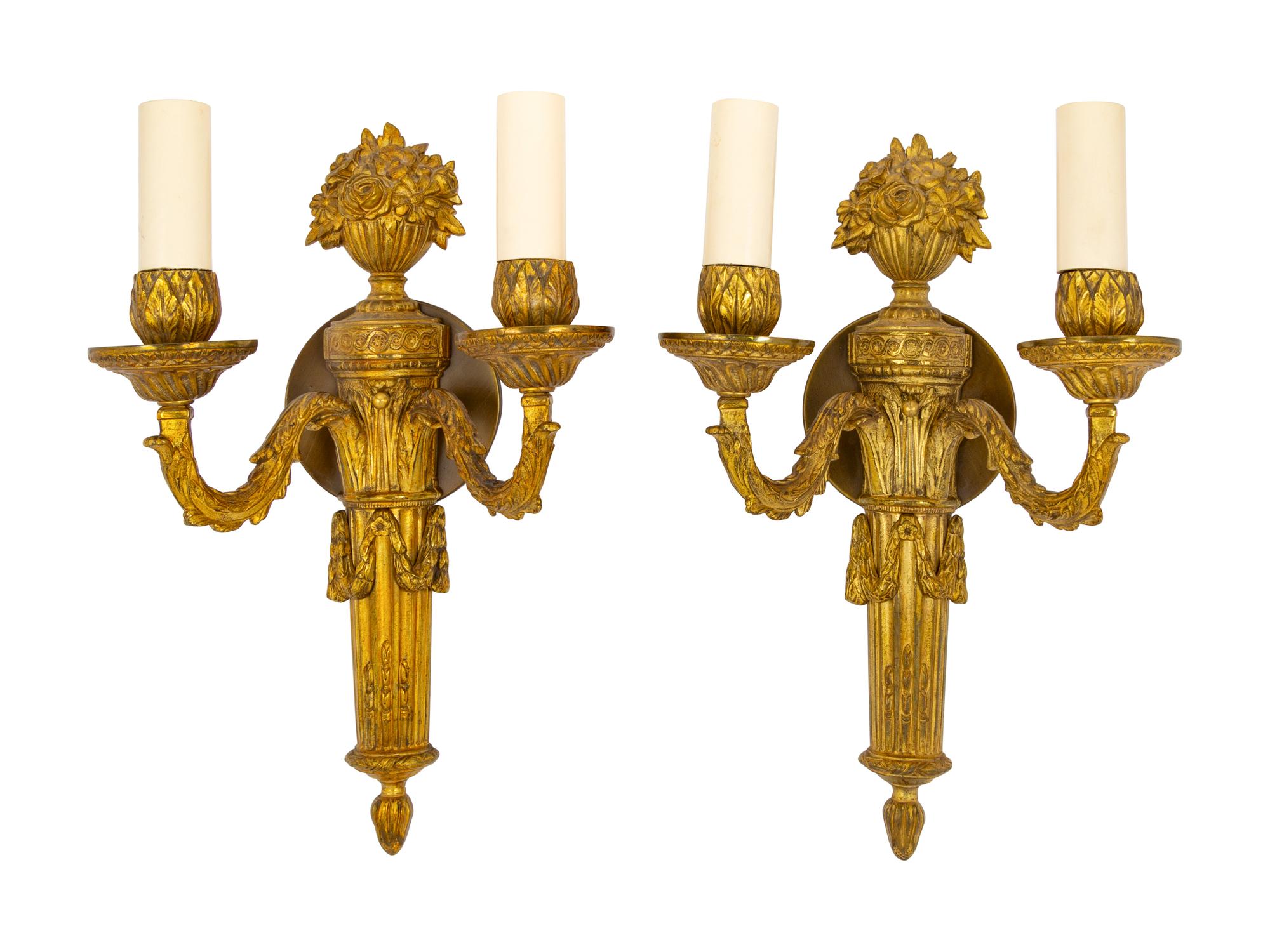 A Pair of Continental Gilt Metal Two-Light Sconces