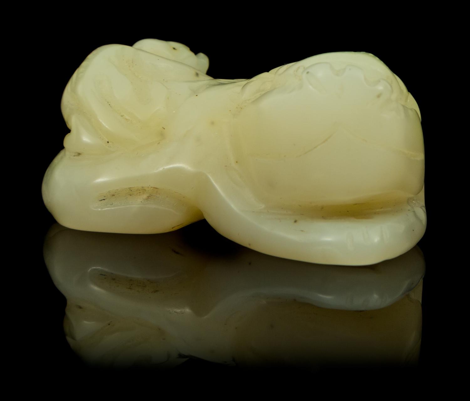 A Carved Jade Toggle Length 1 3/4 inches.