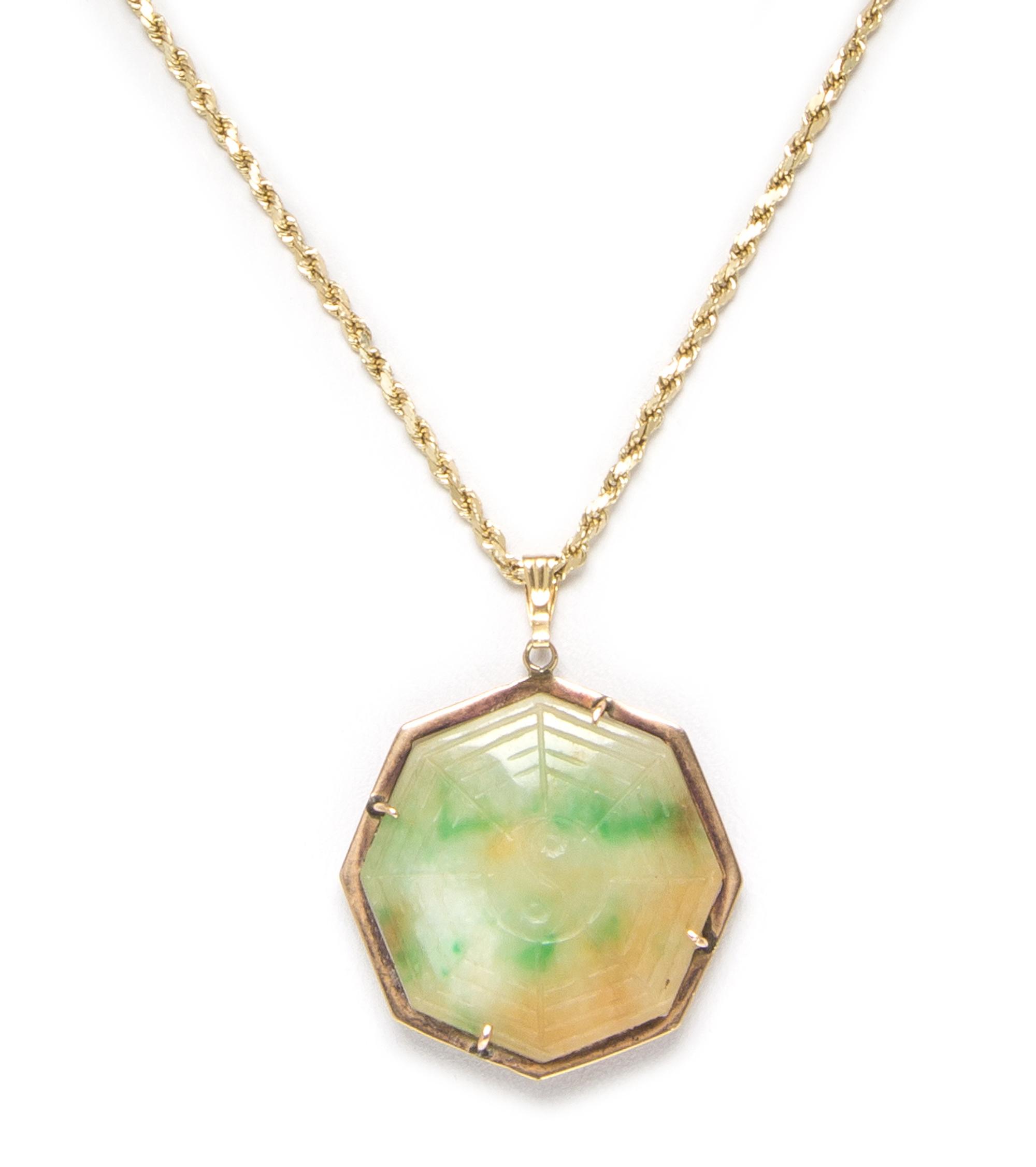 A 14 Karat Yellow Gold and Jade Pendant, 6.30 dwts.
