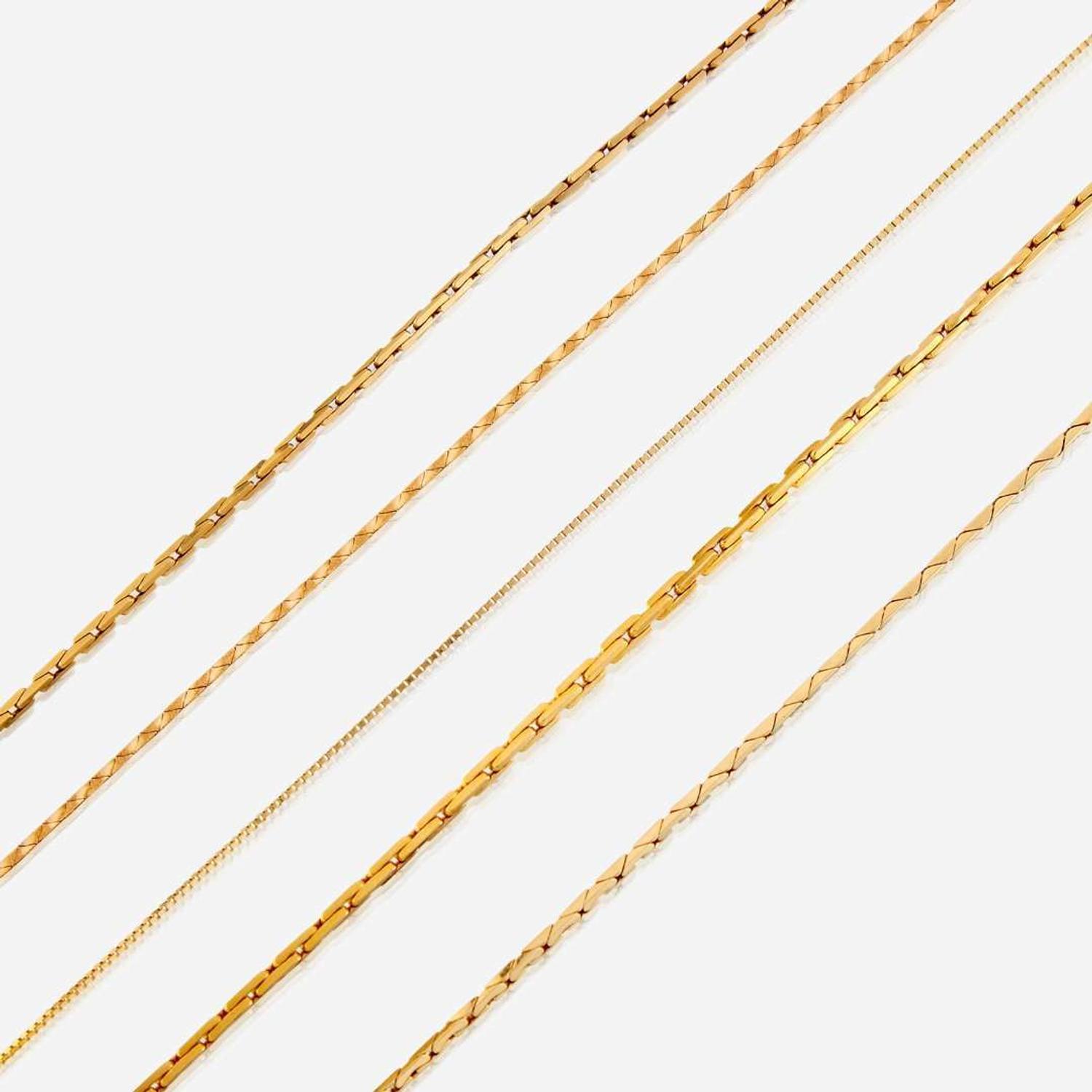 A collection of five fourteen karat gold necklaces