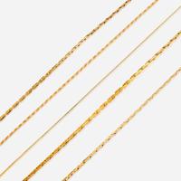 A collection of five fourteen karat gold necklaces