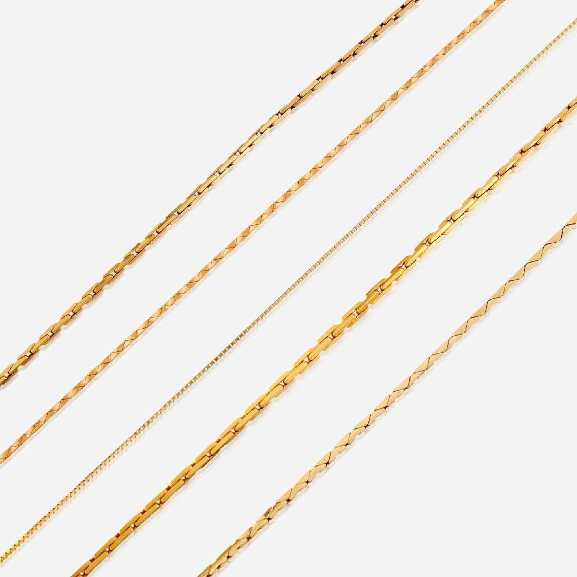 A collection of five fourteen karat gold necklaces