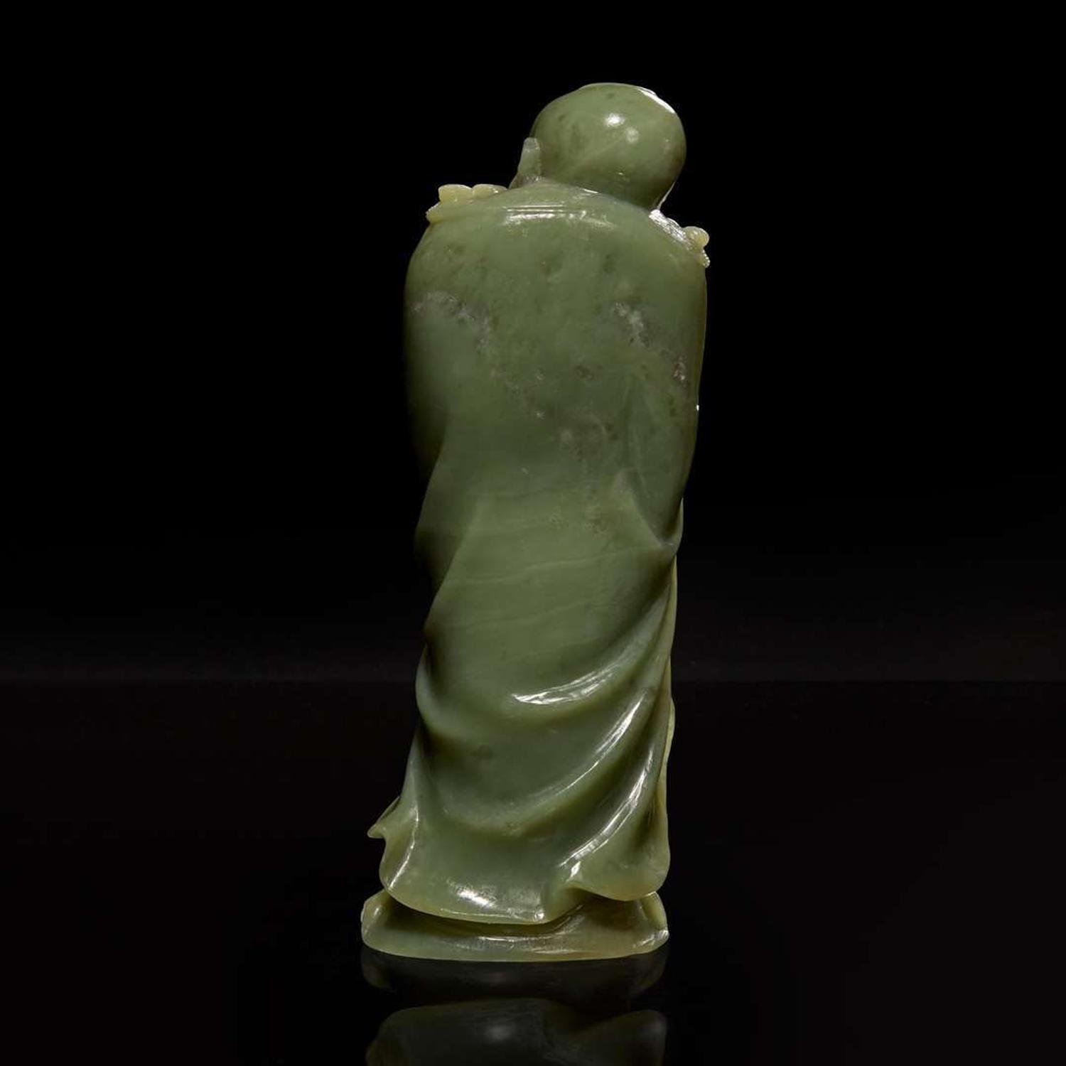 A Chinese carved celadon jade figure of a Lohan 青玉雕羅漢