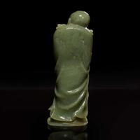 A Chinese carved celadon jade figure of a Lohan 青玉雕羅漢