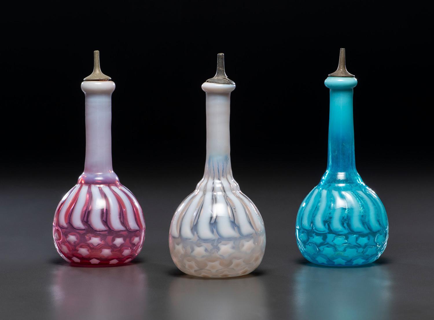 Three 'Stars and Stripes' Opalescent Glass Barber Bottles