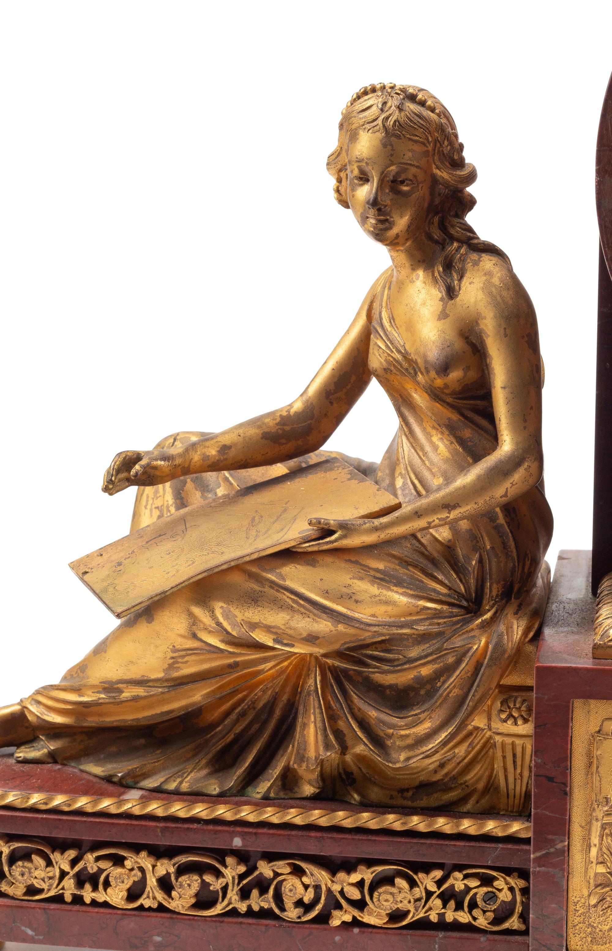 A Louis XVI Style Gilt Bronze and Rouge Griotte Marble Mantel Clock