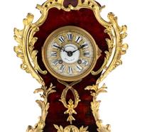 A Louis XV Style Gilt Metal and Faux Tortoise Shell Mantel Clock