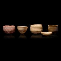A Group of Four Assorted Japanese Chawan and a Sake Cup, Primarily 20th Century