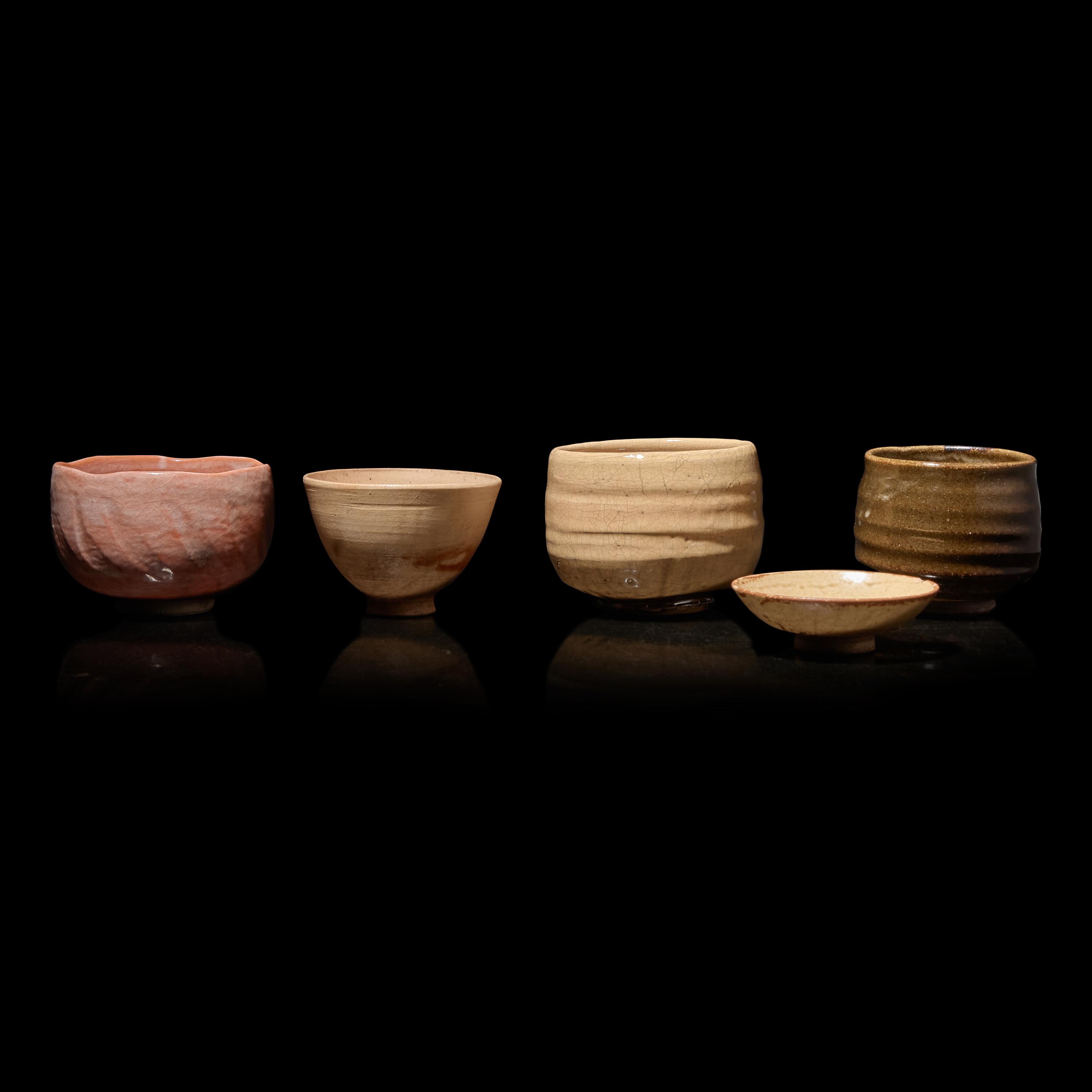 A Group of Four Assorted Japanese Chawan and a Sake Cup, Primarily 20th Century