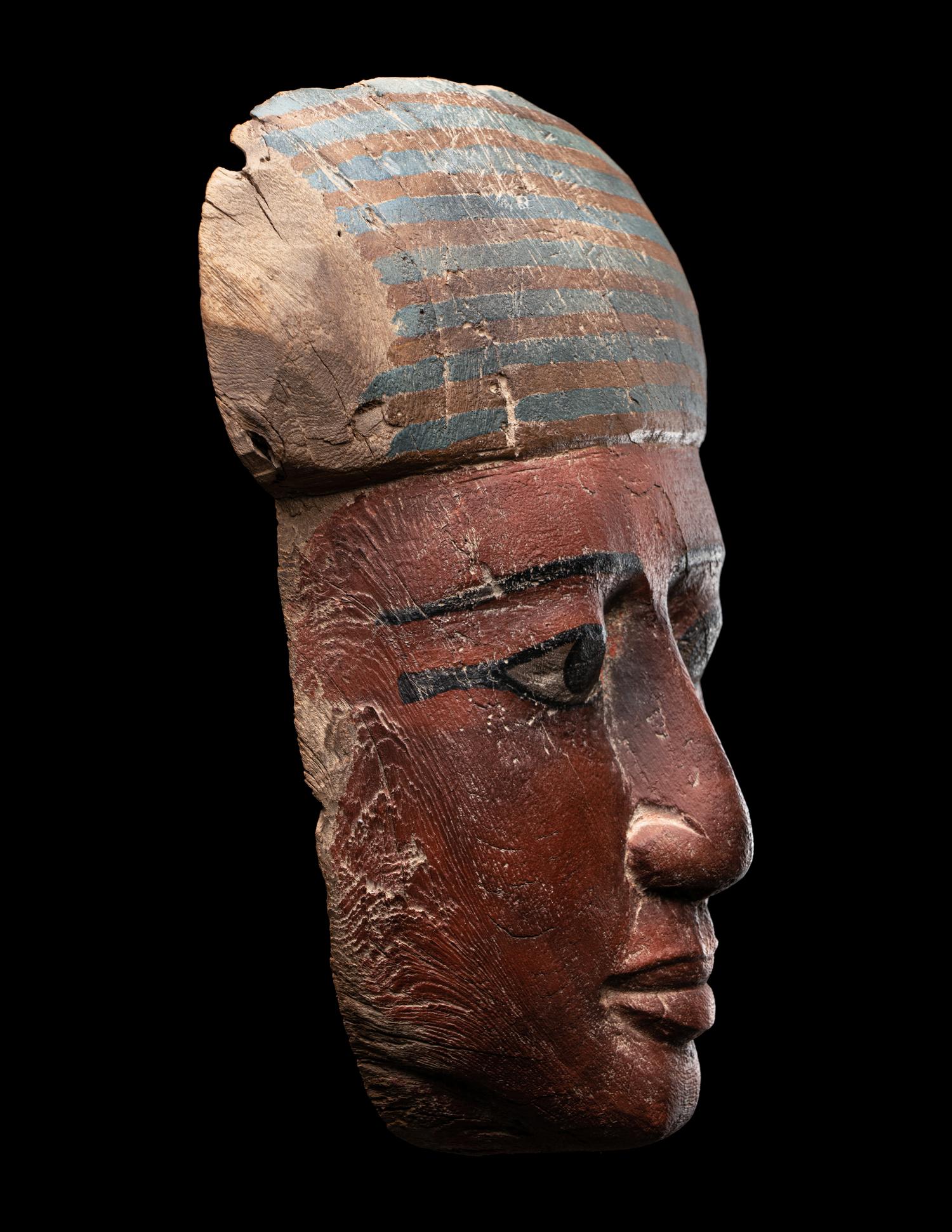 An Egyptian Polychrome Wood Mummy Mask