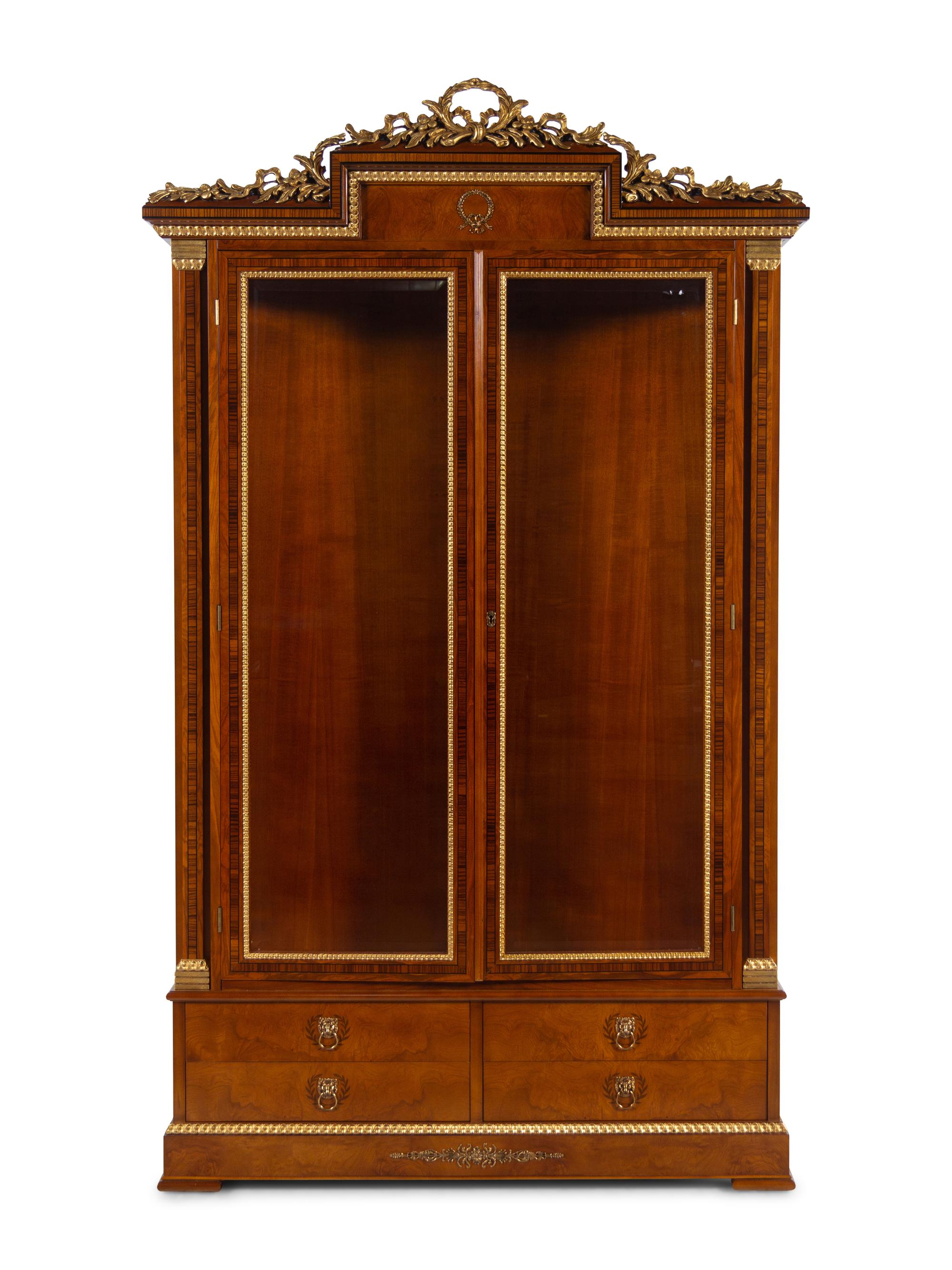An Empire Style Gilt Metal Mounted Vitrine Cabinet