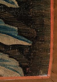 A Continental Wool Verdure Tapestry Fragment