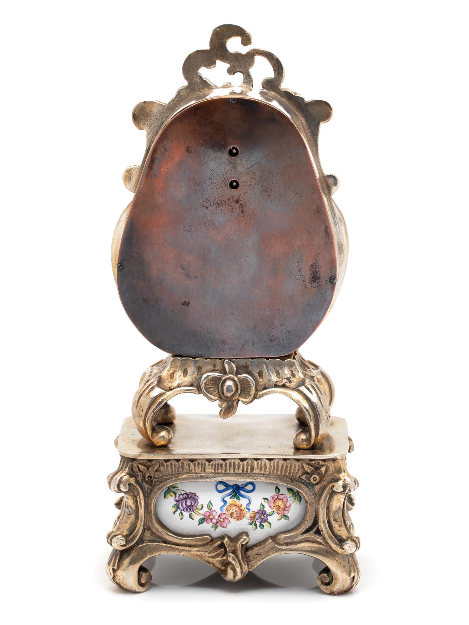 GILT-METAL AND ENAMEL CLOCK WITH HIDDEN AUTOMATON