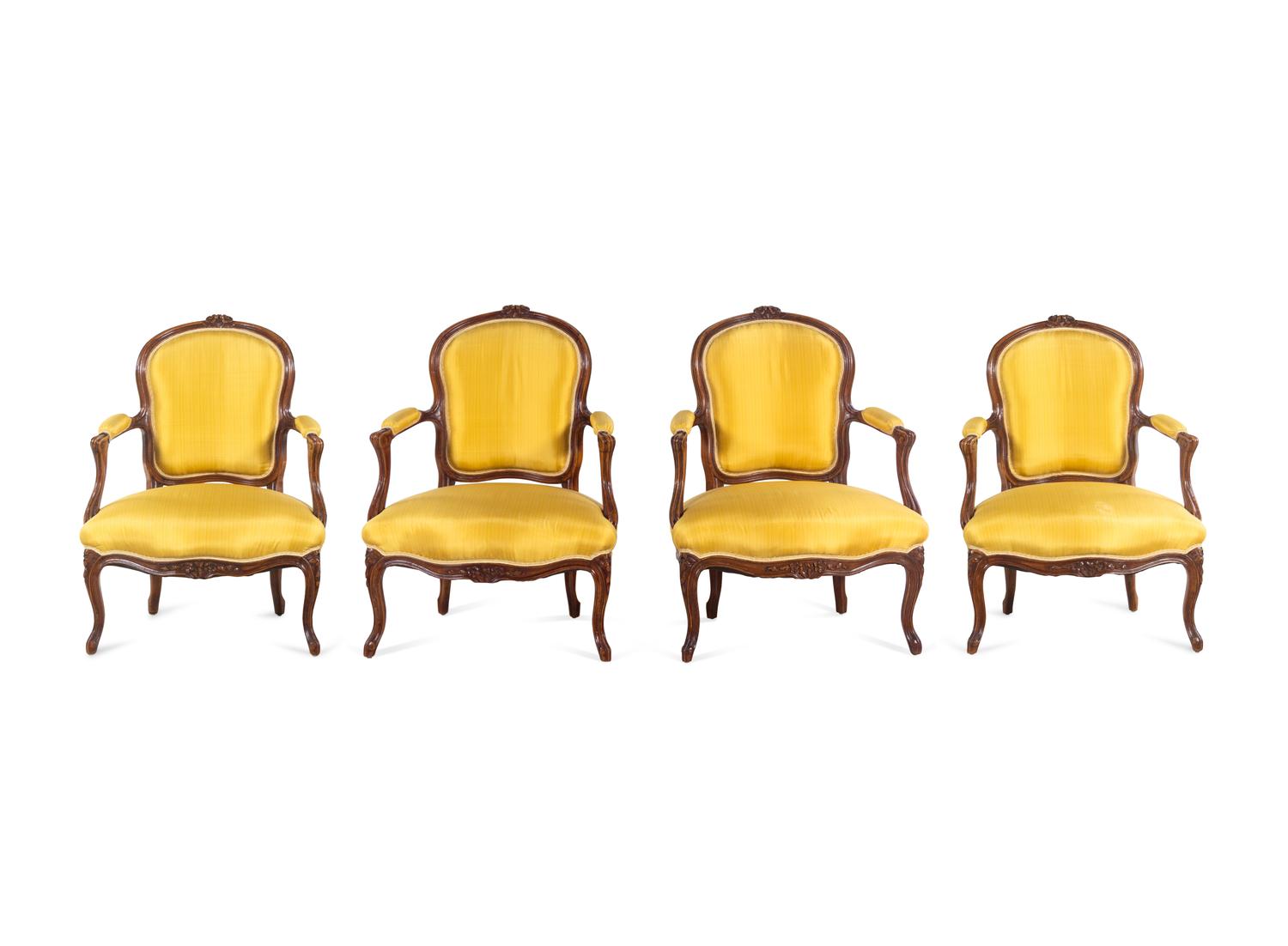 A Set of Four Louis XV Style Walnut Fauteuils
