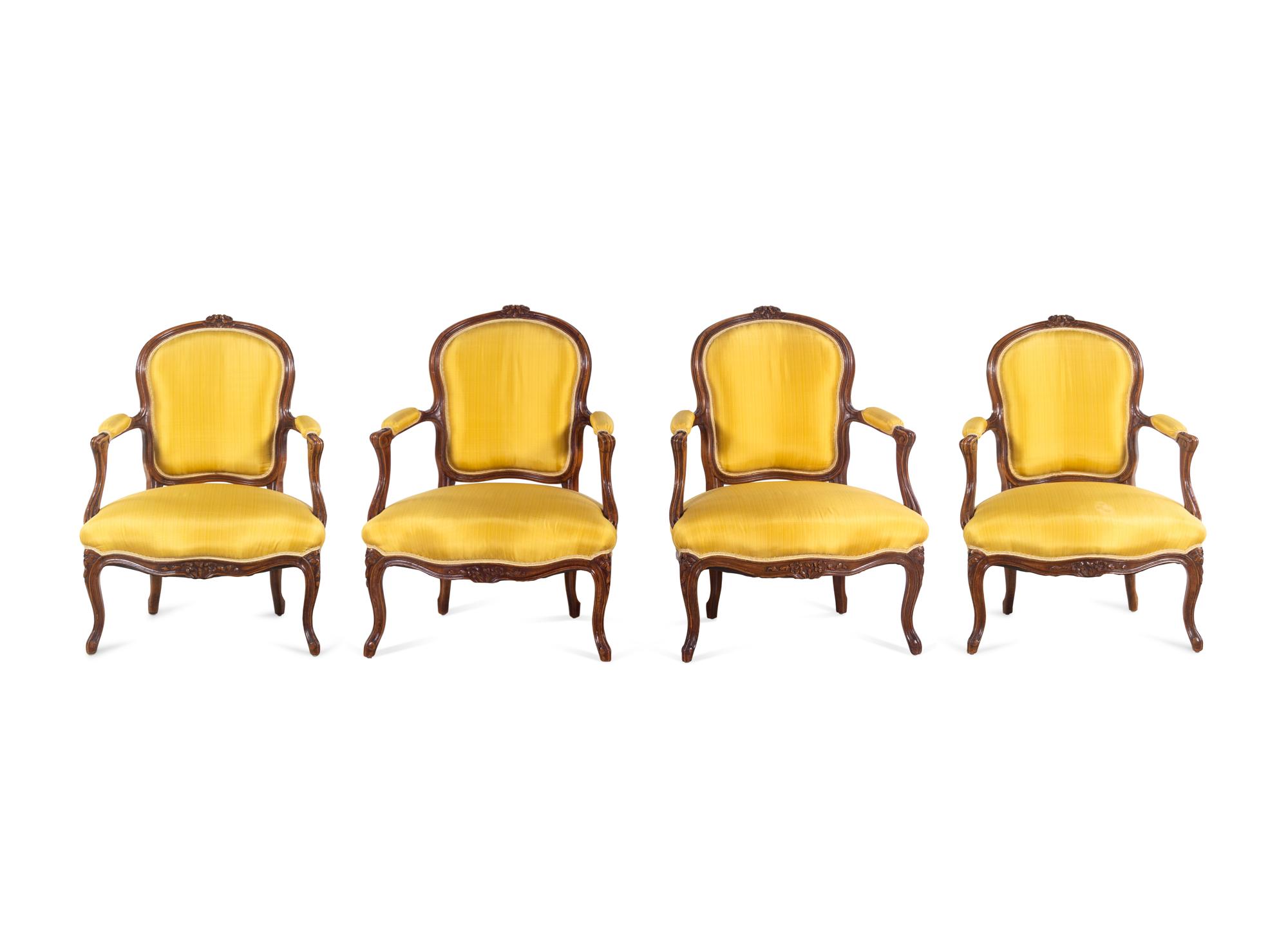 A Set of Four Louis XV Style Walnut Fauteuils