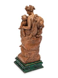 A Continental Terra Cotta Figural Group on a Faux Marble Base
