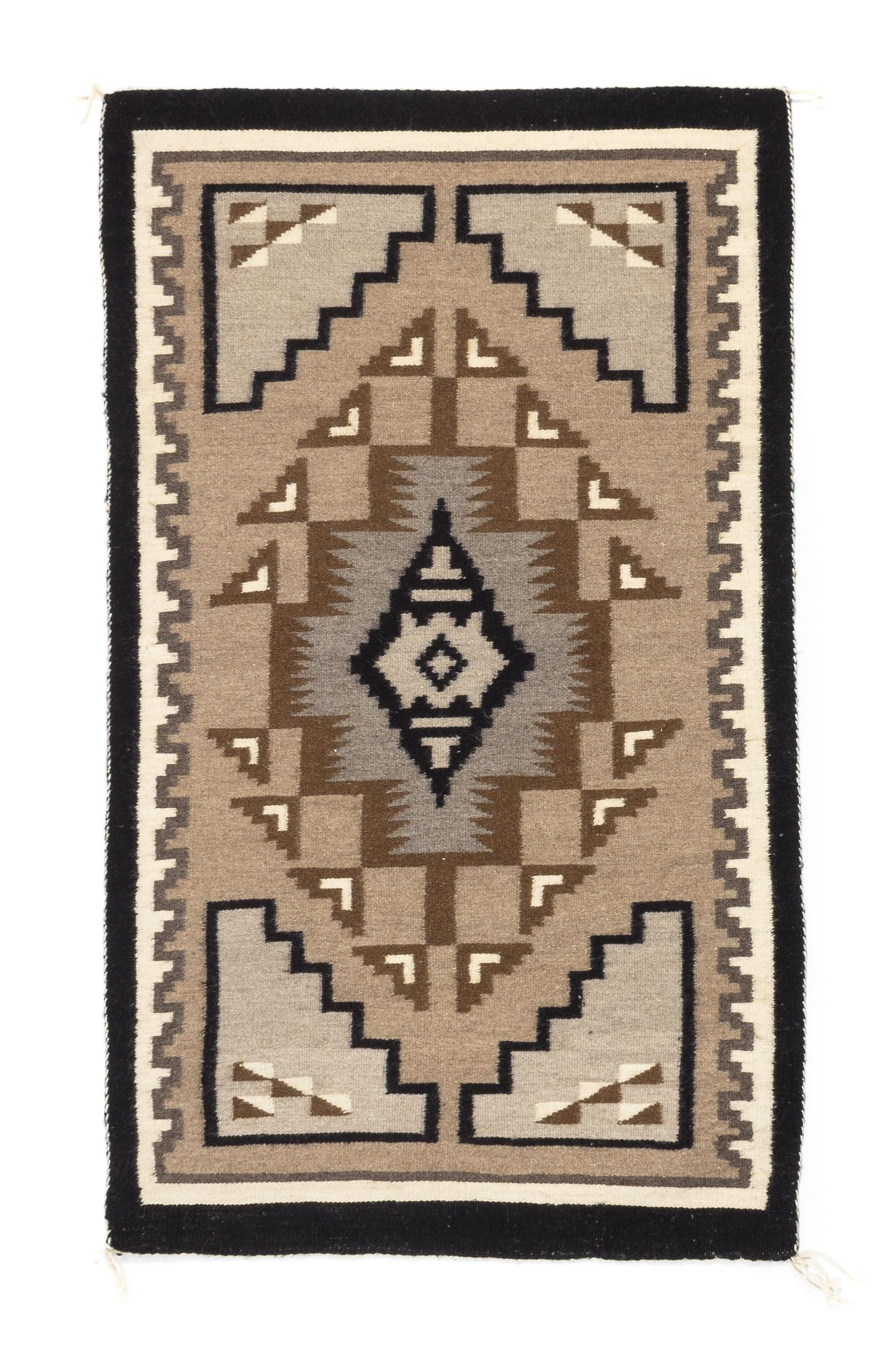Three Navajo Rugs Length of largest 49 x width 32 1/2 inches.