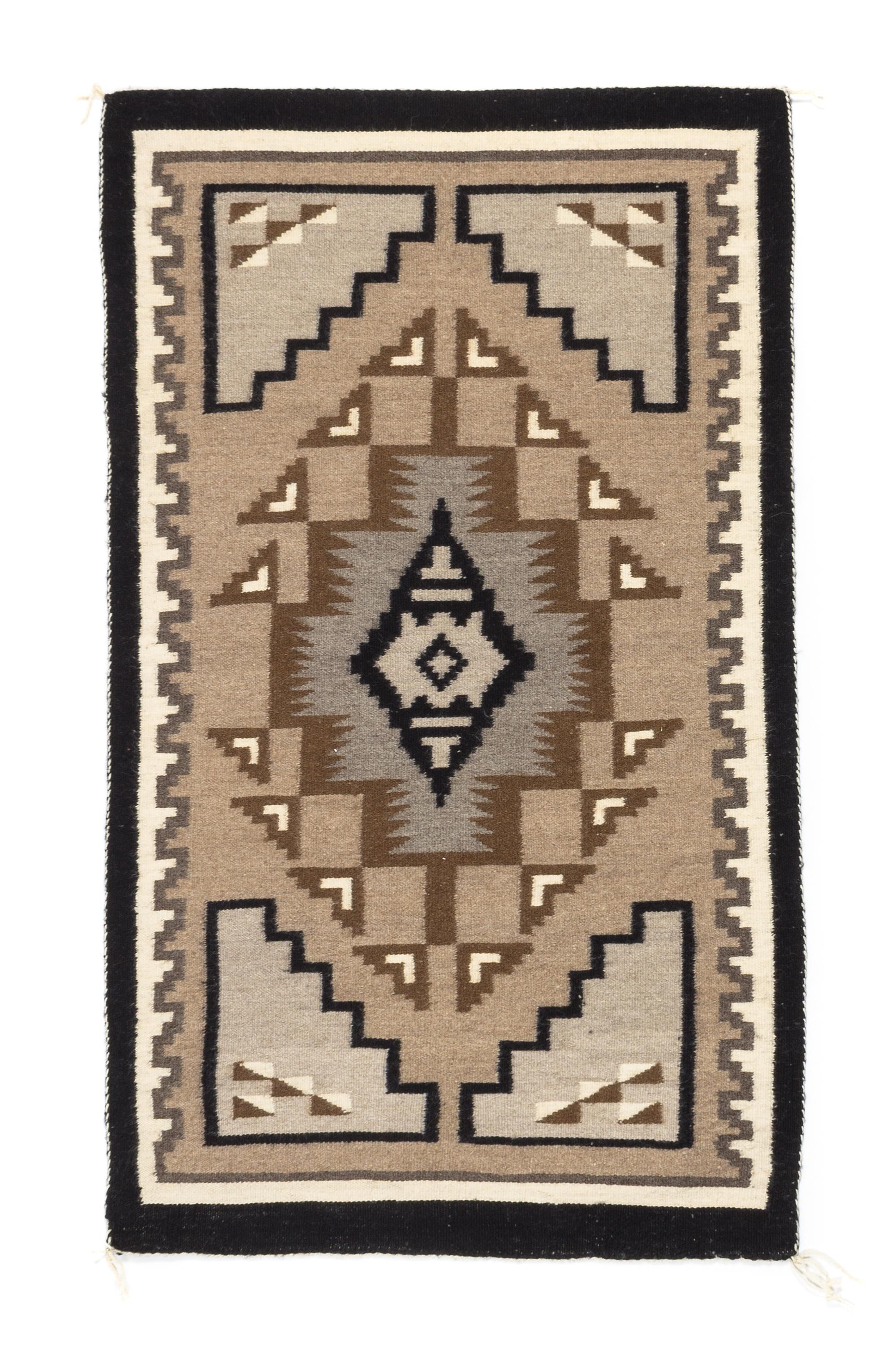 Three Navajo Rugs Length of largest 49 x width 32 1/2 inches.