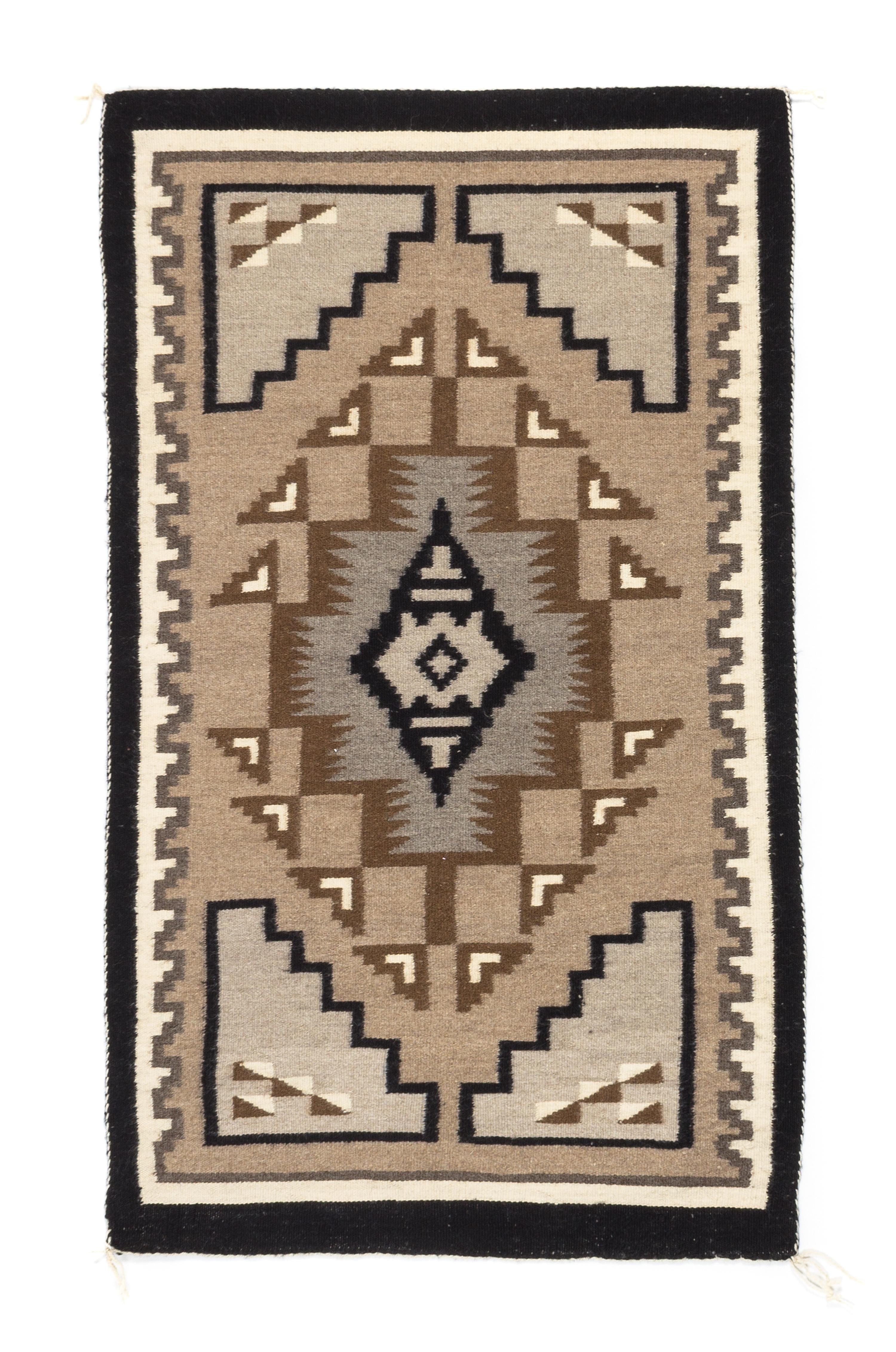 Three Navajo Rugs Length of largest 49 x width 32 1/2 inches.