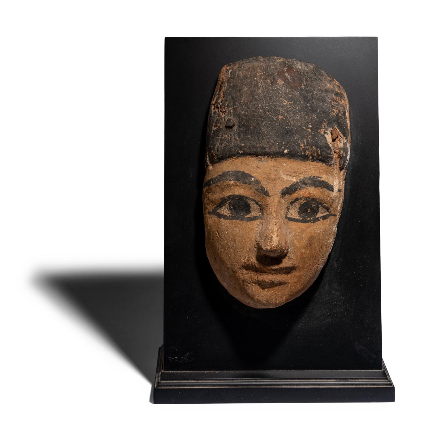 An Egyptian Painted Wood Mummy Mask
