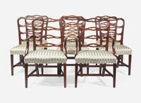 A set of eight Chippendale style mahogany ribbon-back dining chairs, 20th century
